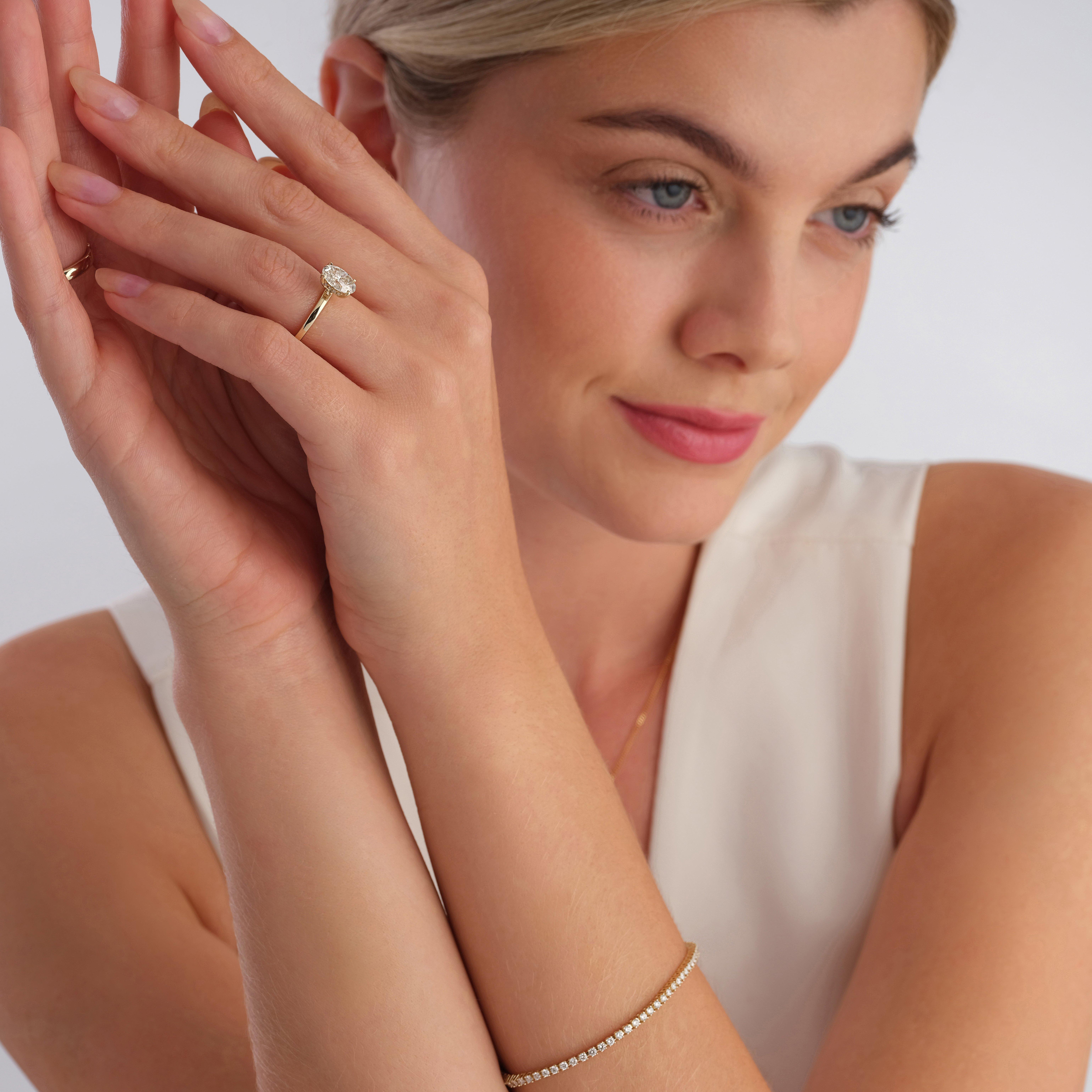 Beaverbrooks 9ct Yellow Gold Oval Shaped Lab Grown Diamond Hidden Halo Solitaire Ring