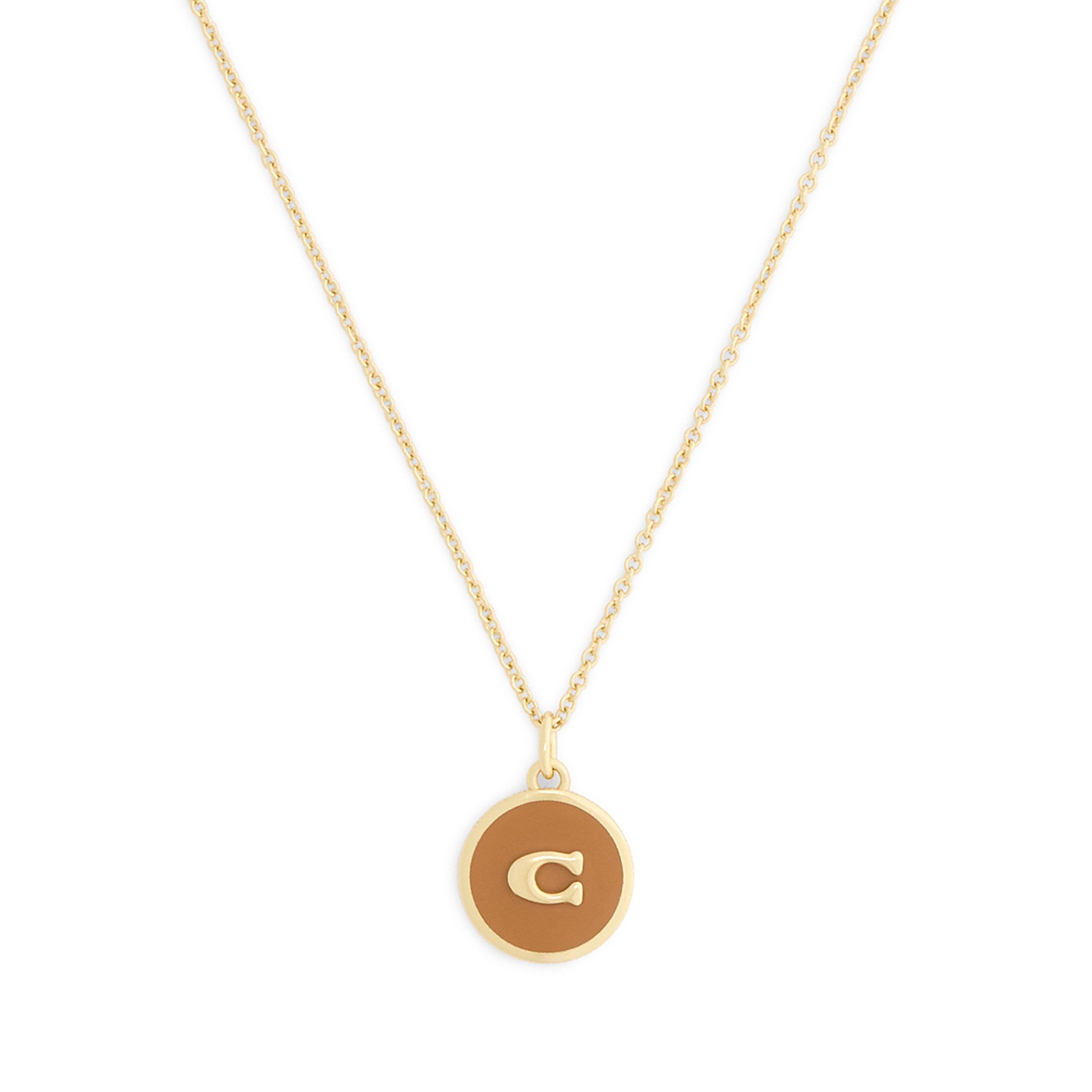 Coach Yellow Gold Tone Pendant