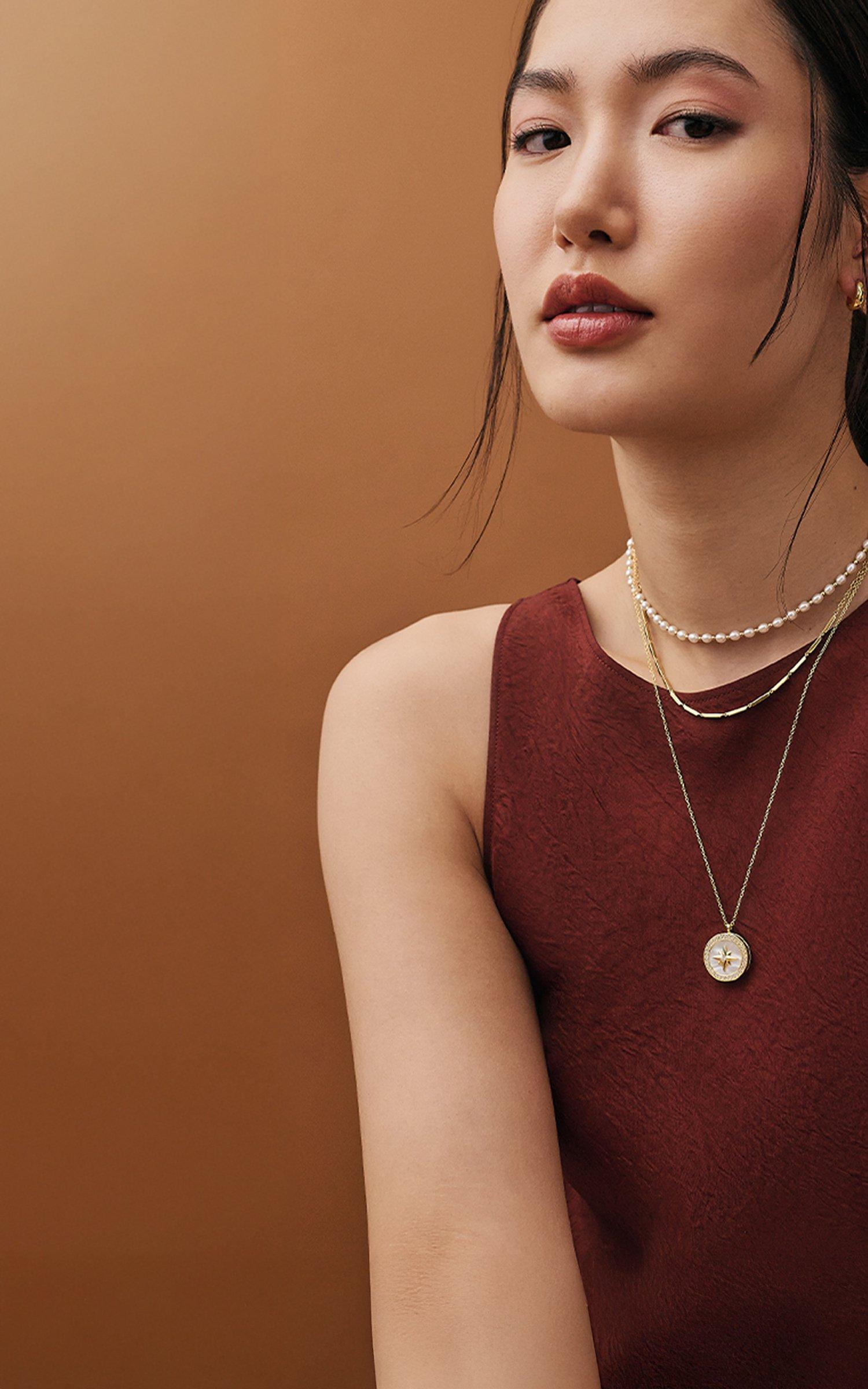 Woman wearing Astley Clarke jewellery